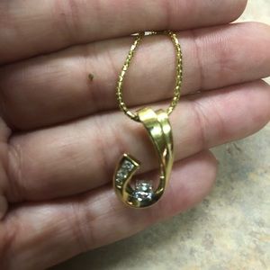 Gold and diamond tear drop necklace.